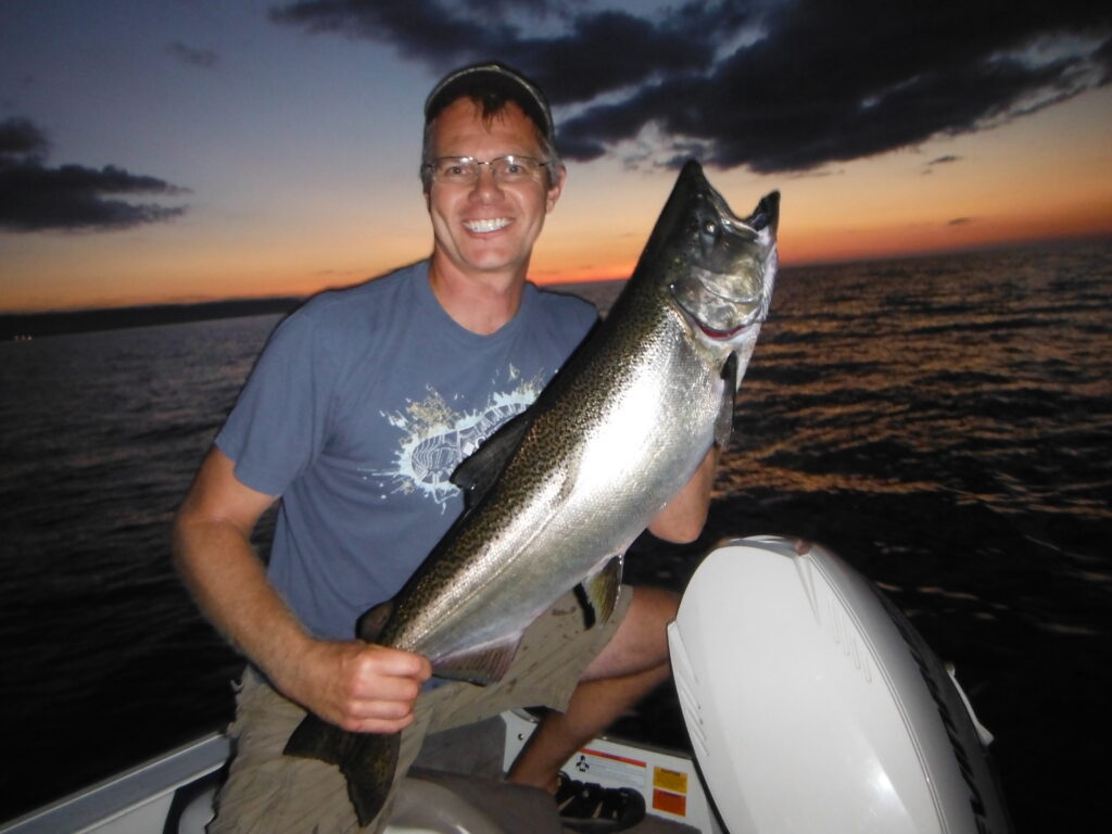 Fred Dobbs, NVCA fisheries biologist with Chinook salmon