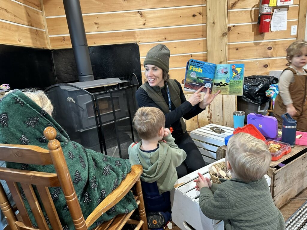 Educator reading story to children Tiffin Nature Program