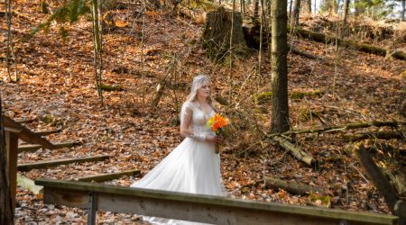 Bride walking down stairs in nature