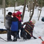 Children digging out quinzhee Camp Tiffin Winter