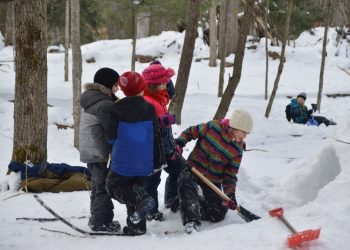 Children digging out quinzhee Camp Tiffin Winter