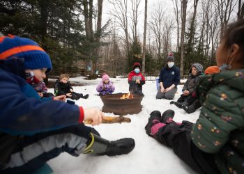 Children gathering around a fire Camp Tiffin Winter