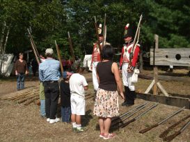 Families learning to hold muskets